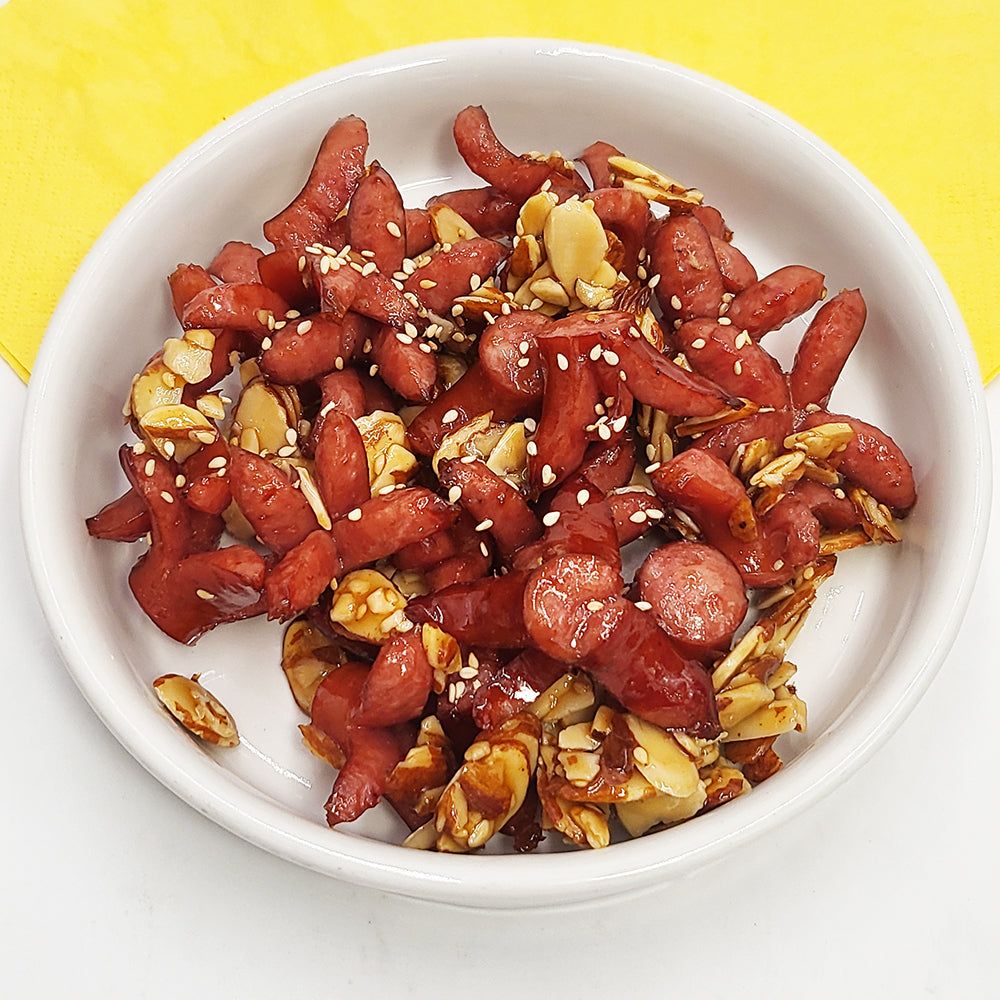 Close-up view of Sausage with almond gangjeong (Korean sweet and crispy sausage) | Banchan365
