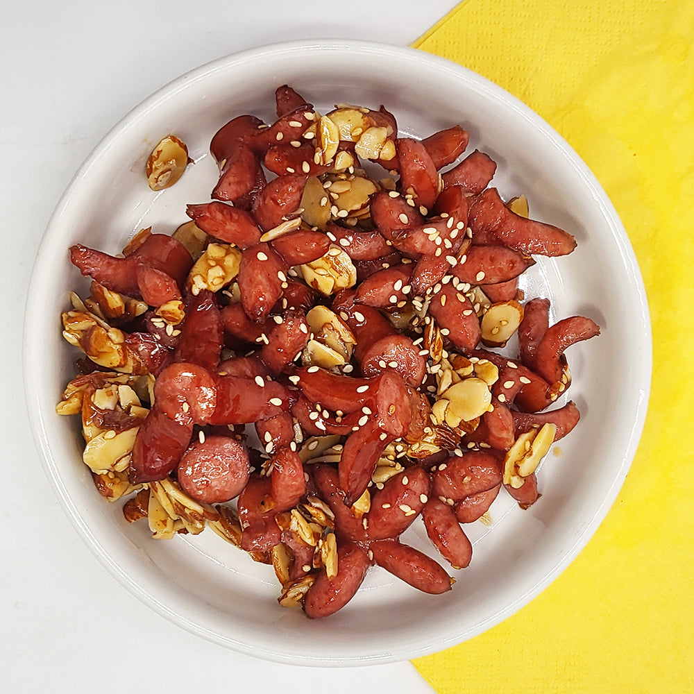 Sausage with almond gangjeong (Korean sweet and crispy sausage) served and plated | Banchan365