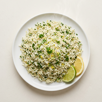 Lemon lime herb rice with lemon and lime wedges, top-down view | Banchan365