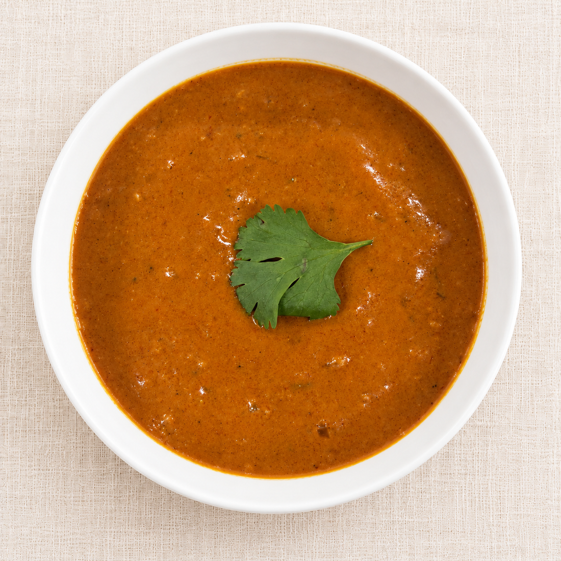 Curry sauce with chicken – smooth orange-red curry sauce garnished with cilantro | Banchan365